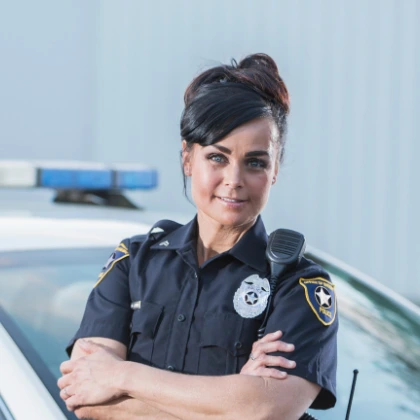 Police Officer in front of police car