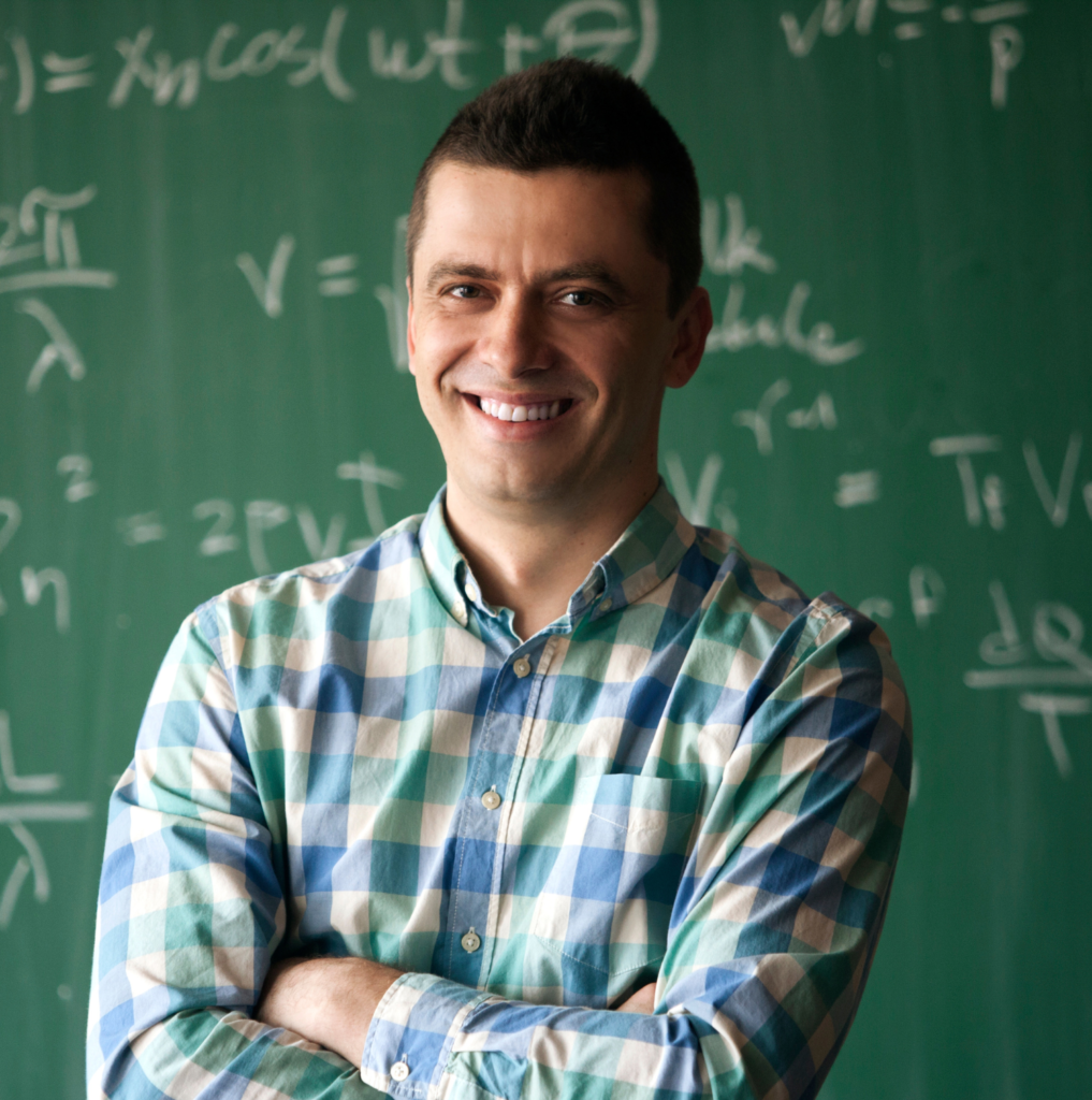 Teacher in front of chalkboard